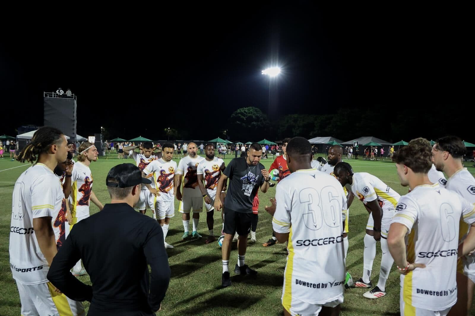 Coach Rafaz talking to his squad on the touchline at TST 2025.